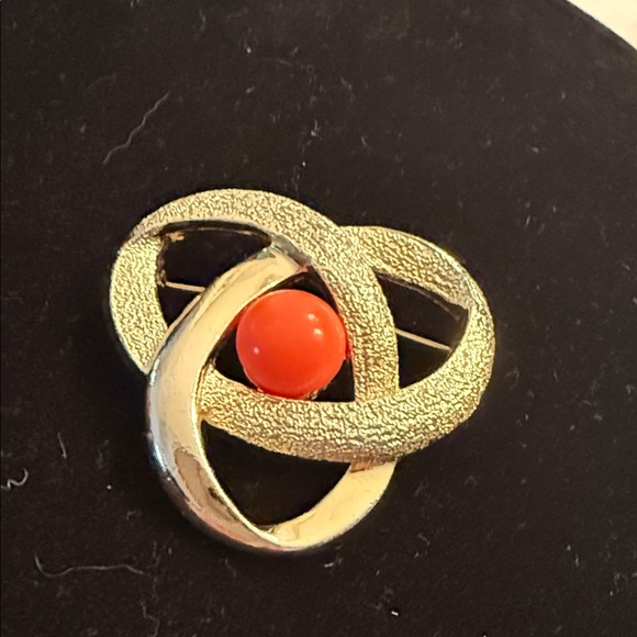 Sarah Coventry Jewelry - Sarah Coventry Gold-Tone Interlocking Knot Brooch with Bright Orange Cabochon